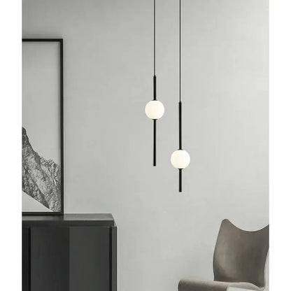 Modern black & gold pendant light with glass shade for living room