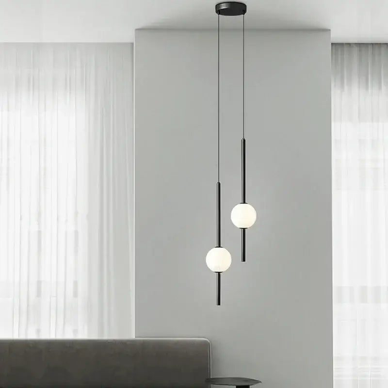 Modern black & gold pendant light with glass shade for living room