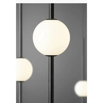 Modern black & gold pendant light with glass shade for living room