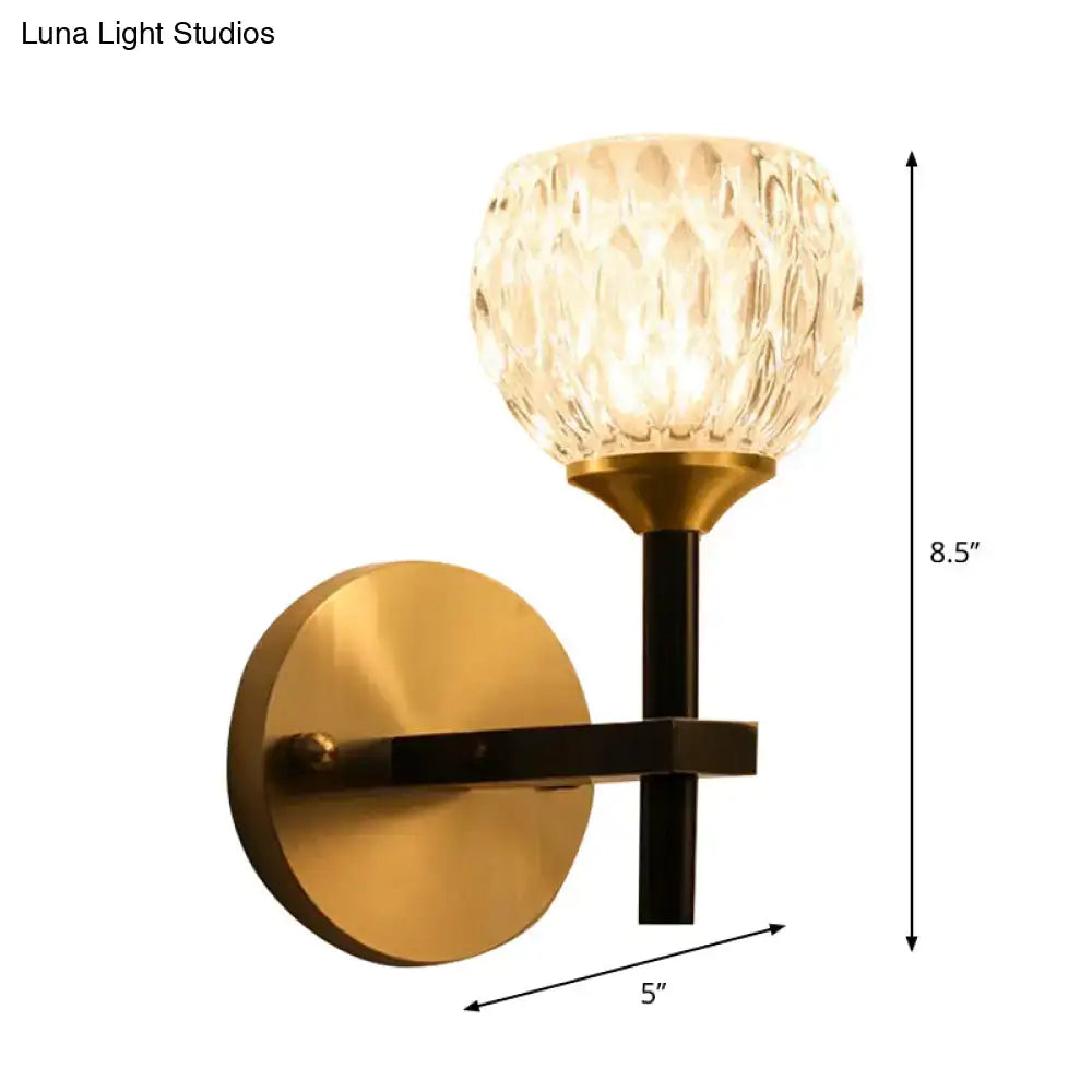 Modern black & gold wall light with dimpled glass for living room