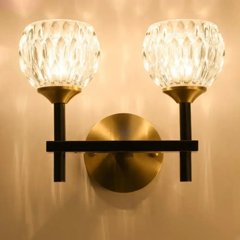 Modern black & gold wall light with dimpled glass for living room