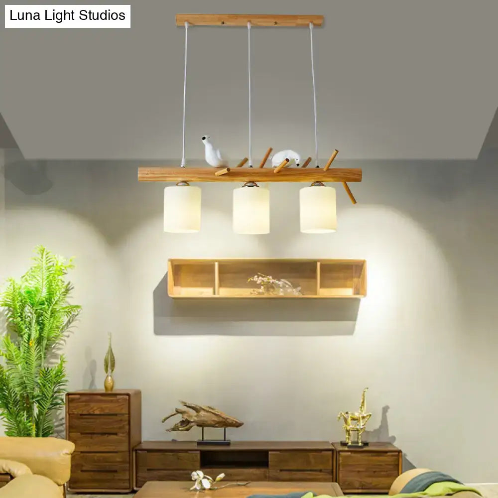 Modern black island pendant light with birds for dining room