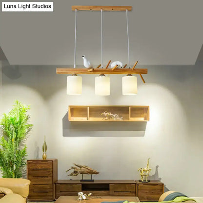 Modern black island pendant light with birds for dining room