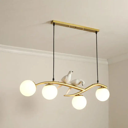 Modern black island pendant light with birds for dining room