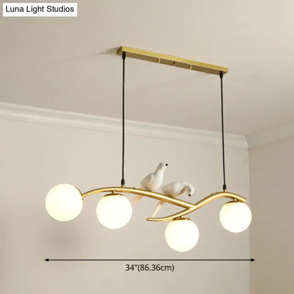 Modern black island pendant light with birds for dining room