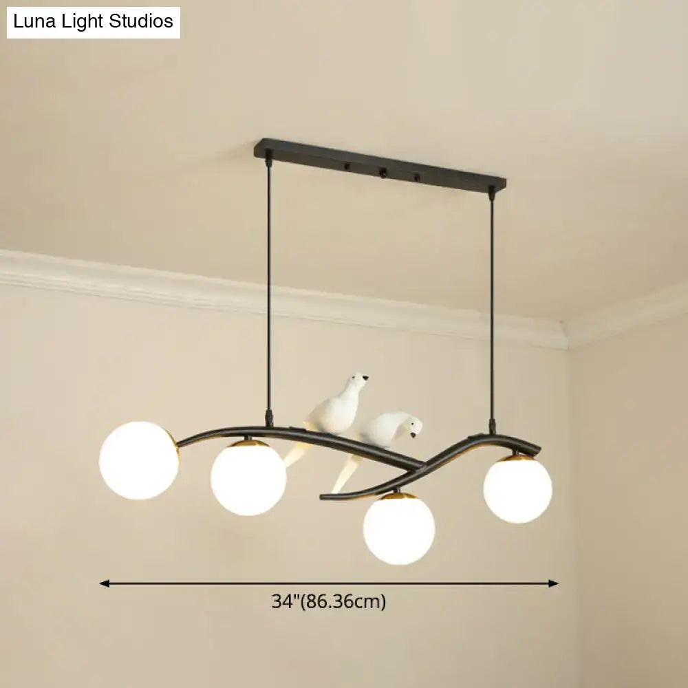 Modern black island pendant light with birds for dining room