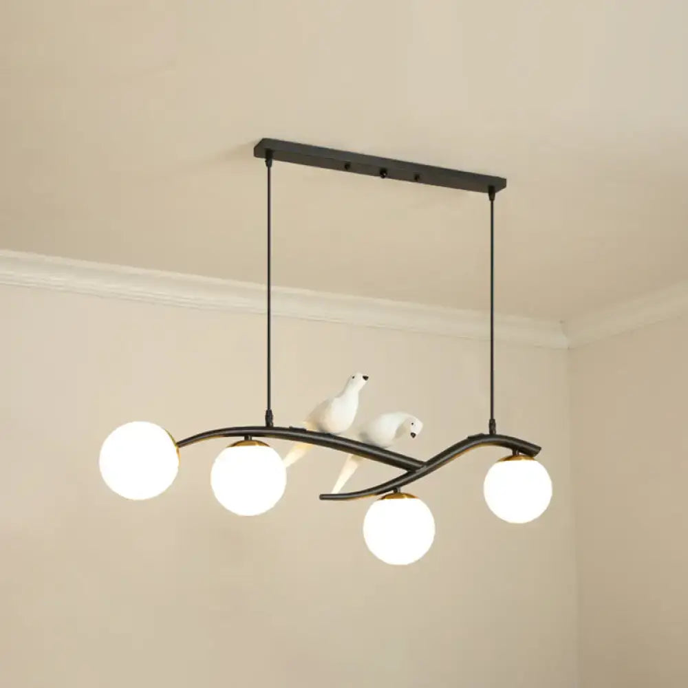 Modern black island pendant light with birds for dining room
