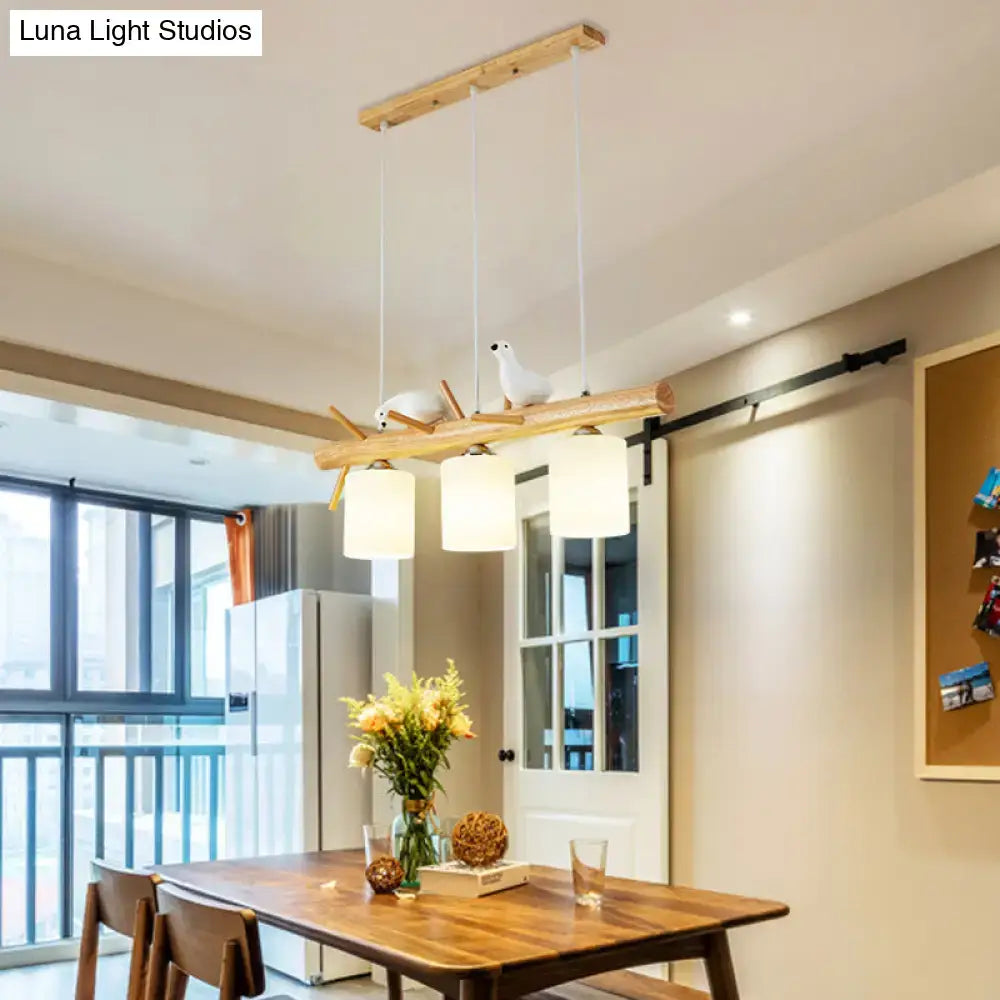 Modern black island pendant light with birds for dining room