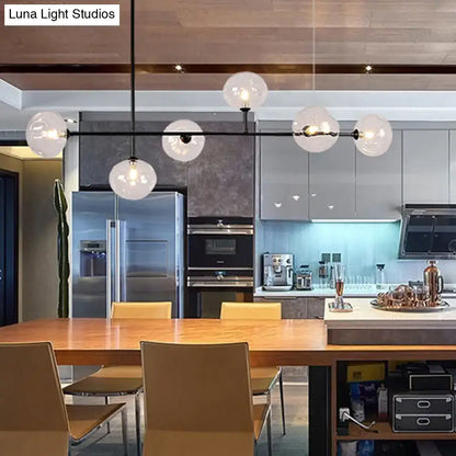 Modern black metal chandelier with glass globes – dining room light
