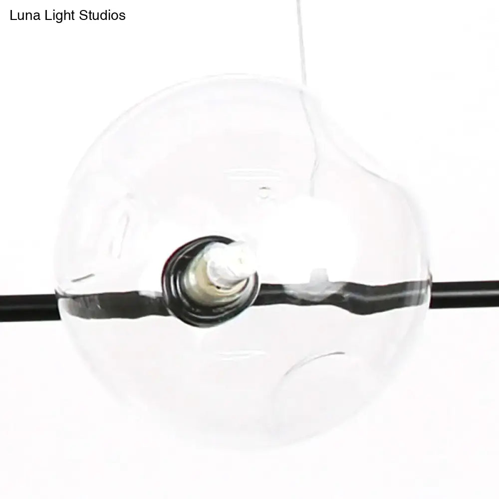 Modern black metal chandelier with glass globes – dining room light