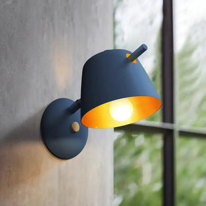 Modern black metal shade wall sconce with white & blue bedroom light