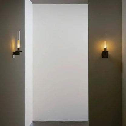 Modern black metal wall light with clear glass shade for bedroom