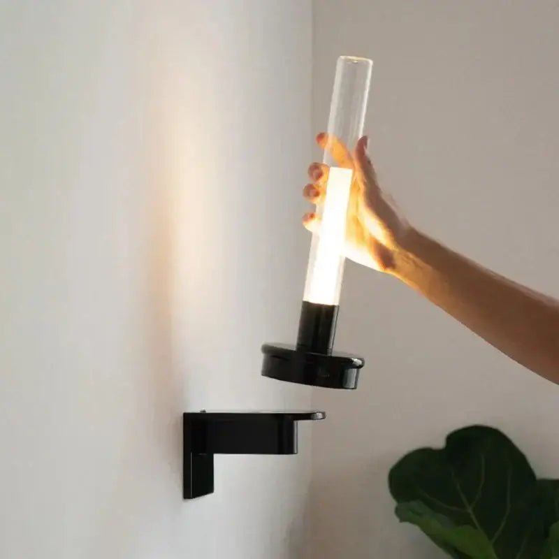 Modern black metal wall light with clear glass shade for bedroom