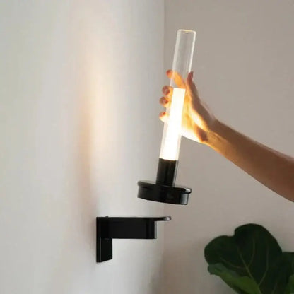 Modern black metal wall light with clear glass shade for bedroom