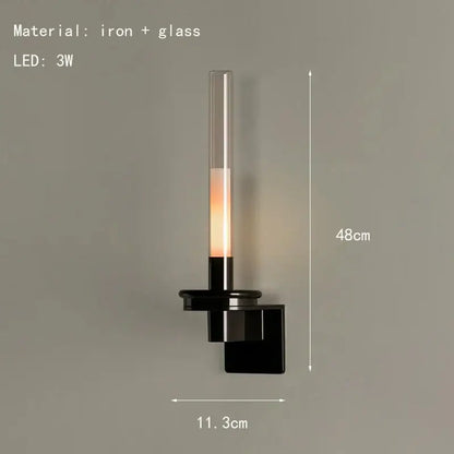 Modern black metal wall light with clear glass shade for bedroom