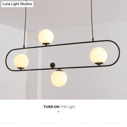 Modern black minimalist ellipse ceiling light with white globes living room