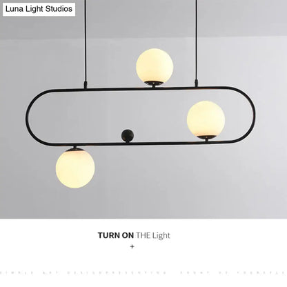 Modern black minimalist ellipse ceiling light with white globes living room