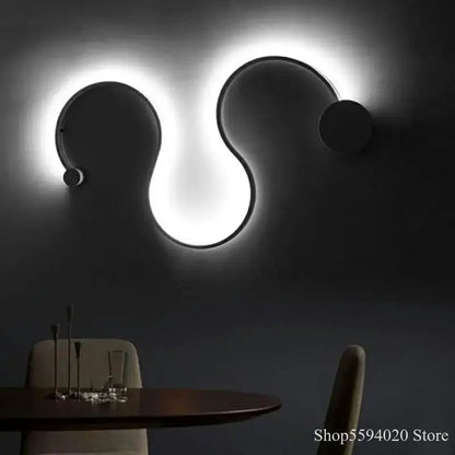 Modern black serpentine led wall sconce for living room decor