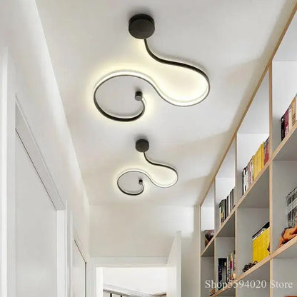 Modern black serpentine led wall sconce for living room decor