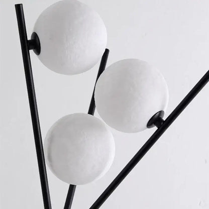 Modern black tripod moon floor lamp with white bulbs living room
