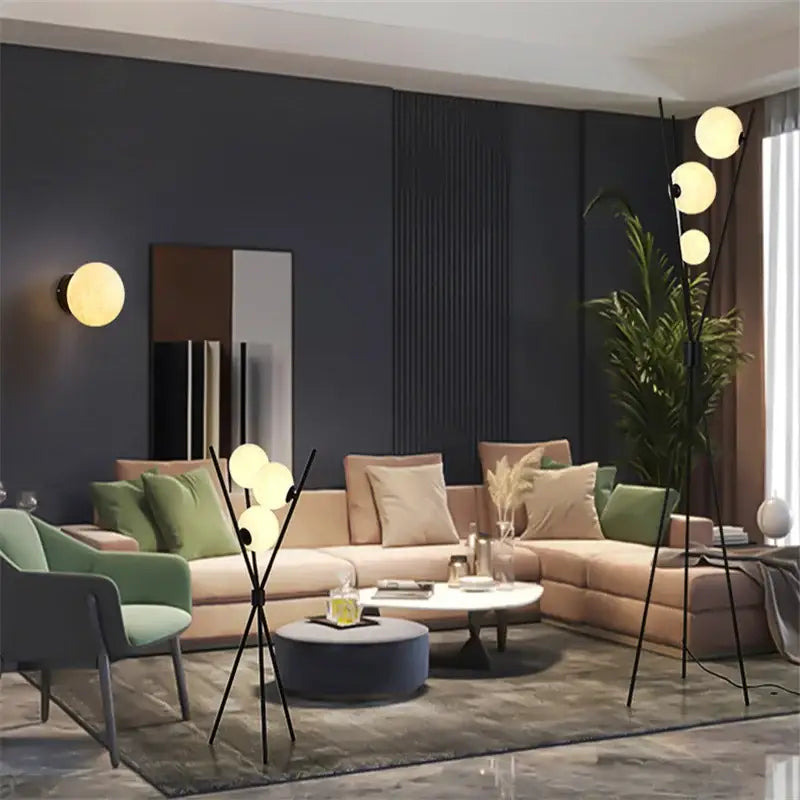 Modern black tripod moon floor lamp with white bulbs living room