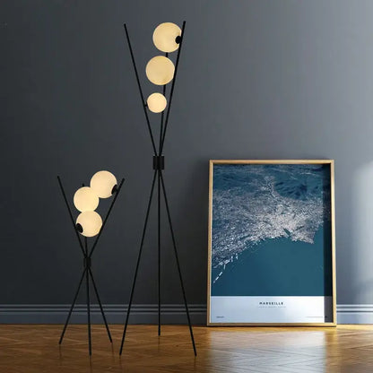 Modern black tripod moon floor lamp with white bulbs living room