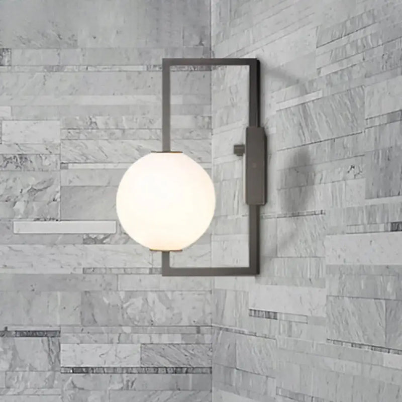 Modern black wall sconce with white glass orb – bedroom light