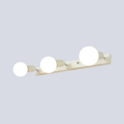 Modern black & white bedroom vanity light with exposed bulbs