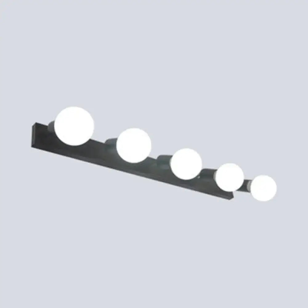Modern black & white bedroom vanity light with exposed bulbs
