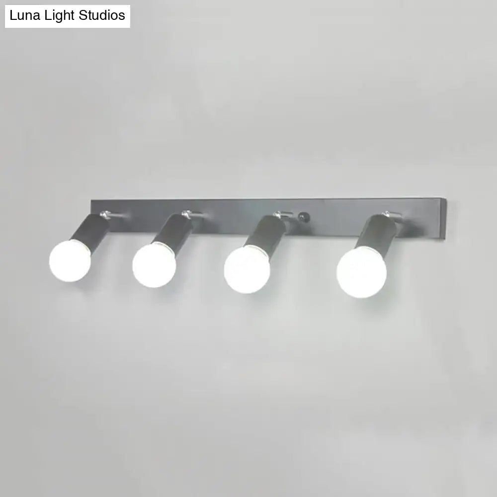 Modern black & white bedroom vanity light with exposed bulbs