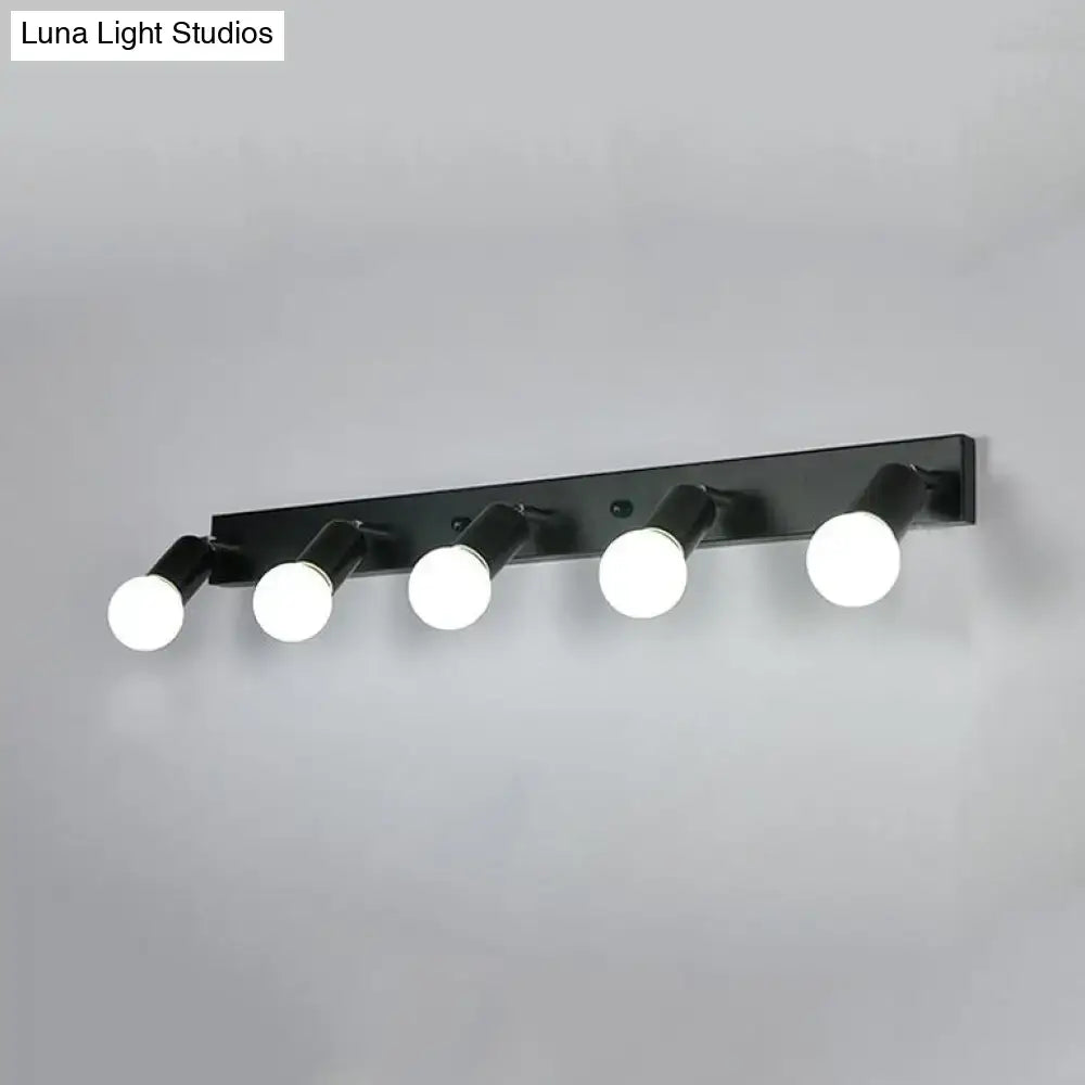 Modern black & white bedroom vanity light with exposed bulbs