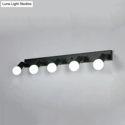 Modern black & white bedroom vanity light with exposed bulbs