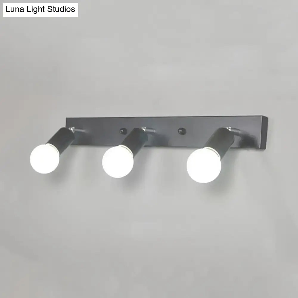 Modern black & white bedroom vanity light with exposed bulbs