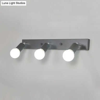Modern black & white bedroom vanity light with exposed bulbs