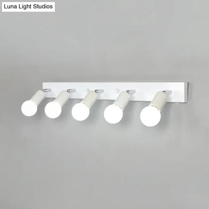 Modern black & white bedroom vanity light with exposed bulbs