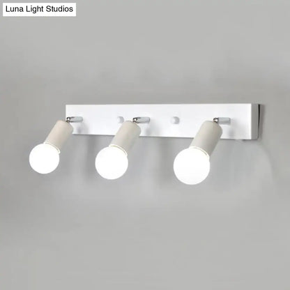 Modern black & white bedroom vanity light with exposed bulbs