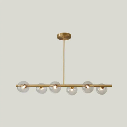 Modern brass 5-light pendant light with spherical glass shade dining room