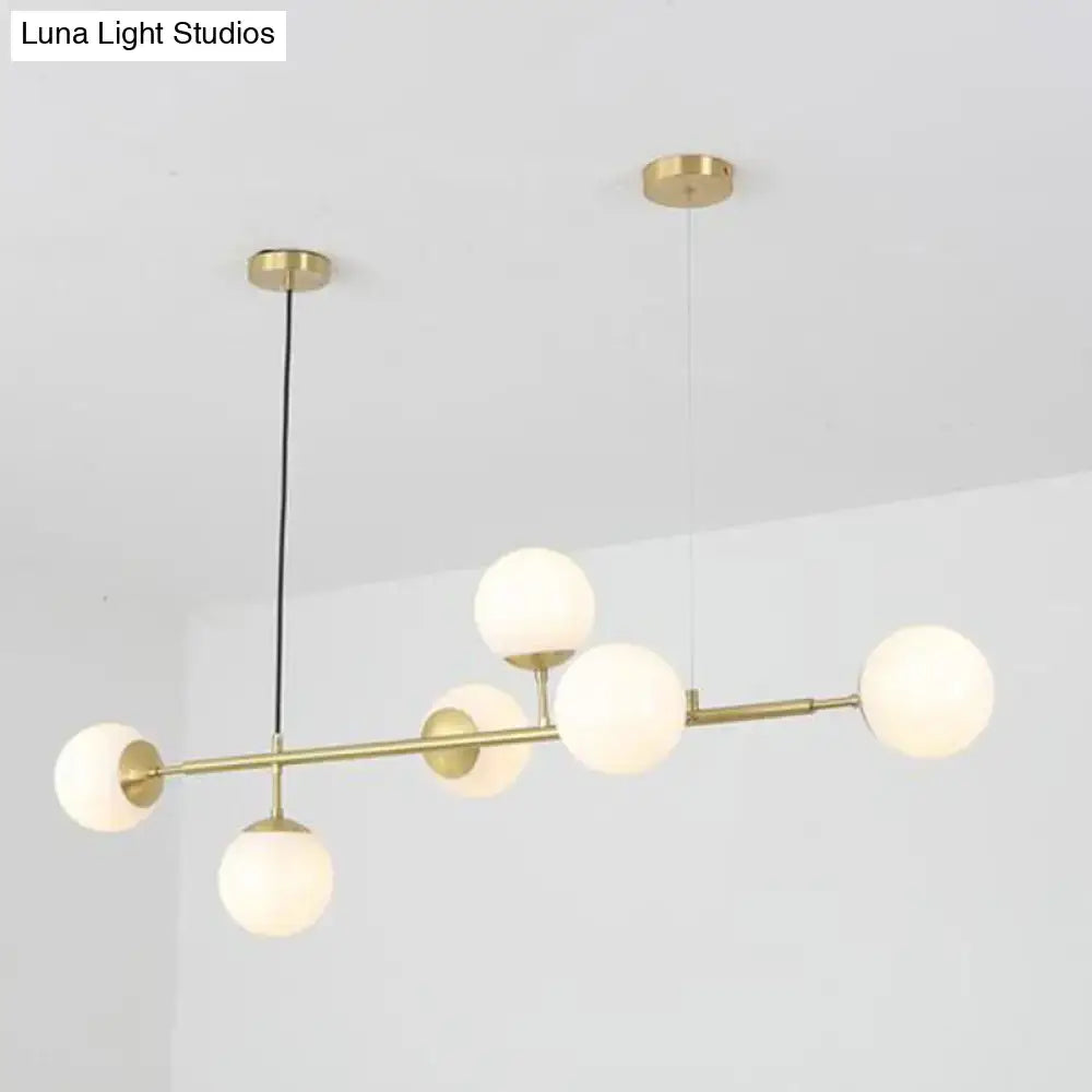 Modern brass 6-bulb island lamp with glass shade for dining rooms