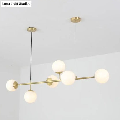 Modern brass 6-bulb island lamp with glass shade for dining rooms