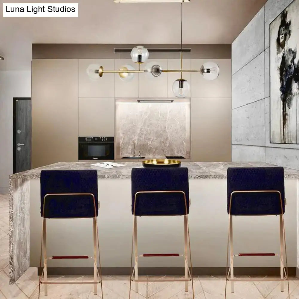 Modern brass 6-bulb island lamp with glass shade for dining rooms