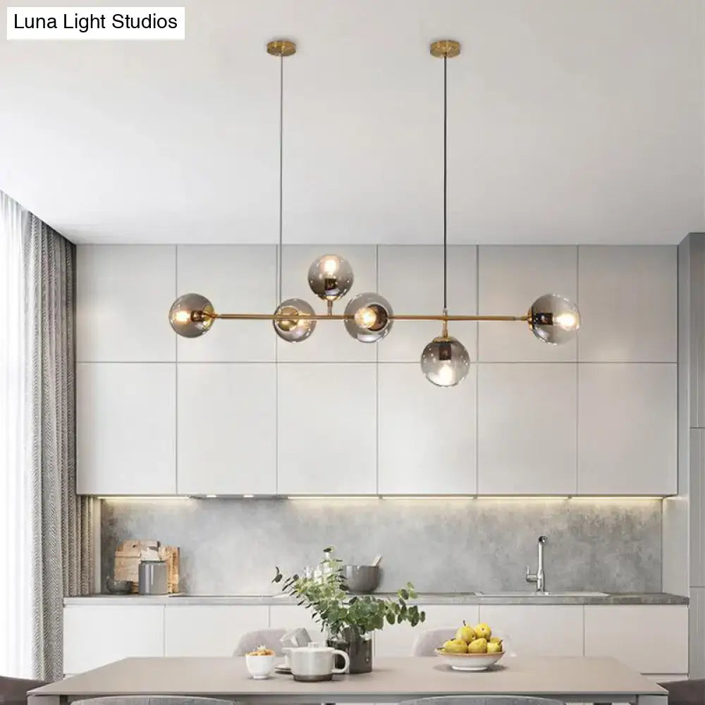 Modern brass 6-bulb island lamp with glass shade for dining rooms