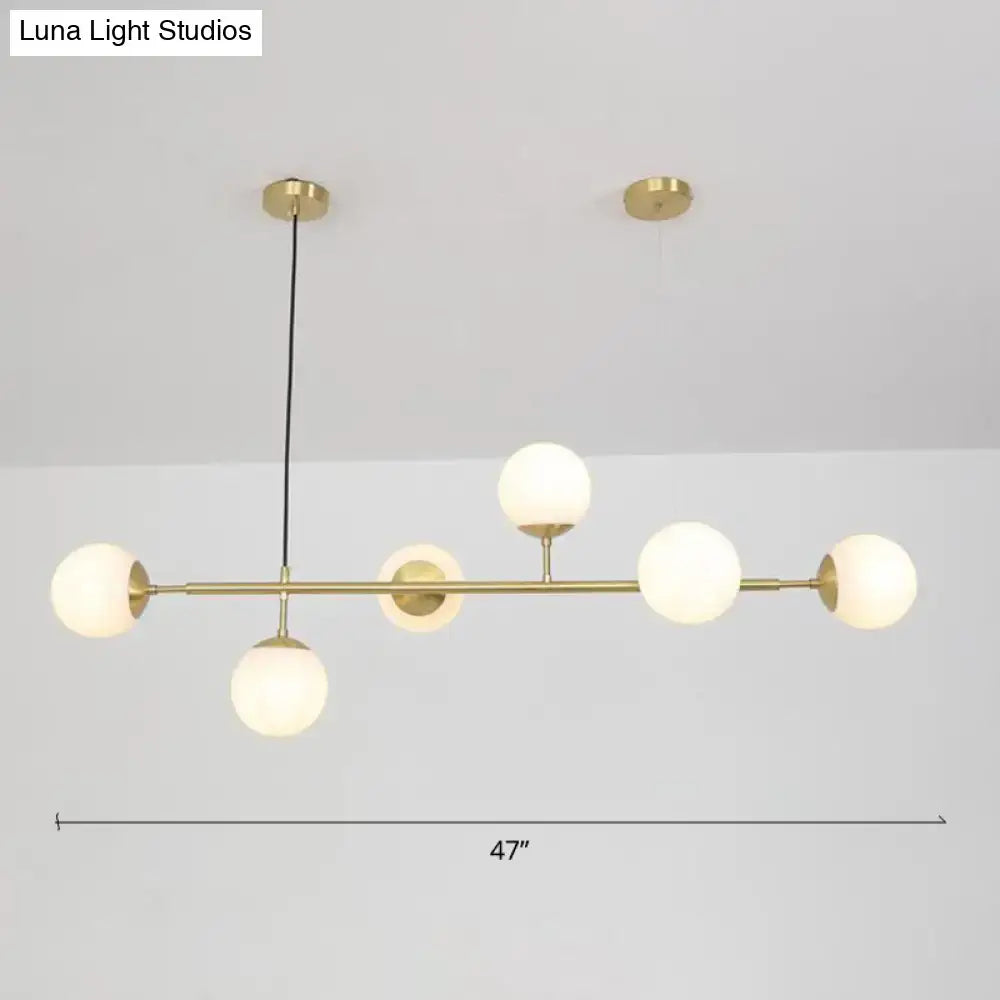 Modern brass 6-bulb island lamp with glass shade for dining rooms