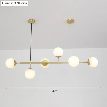 Modern brass 6-bulb island lamp with glass shade for dining rooms