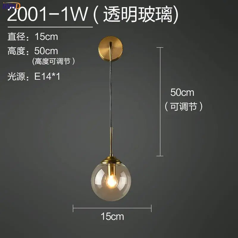 Modern brass and amber glass ball wall lamp for bedroom