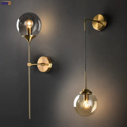 Modern brass and amber glass ball wall lamp for bedroom