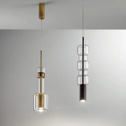 Modern brass and black cylindrical glass pendant light for kitchens
