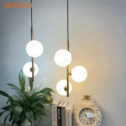 Modern brass and black glass ball pendant light dining room