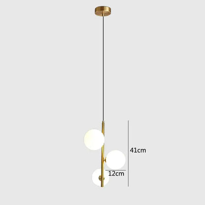 Modern brass and black glass ball pendant light dining room