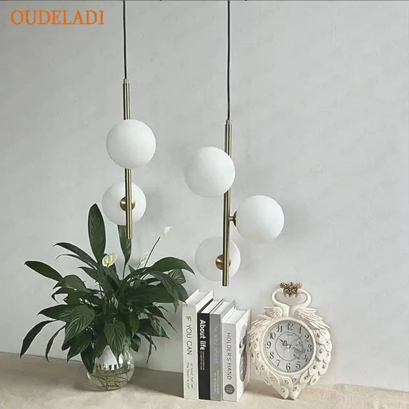 Modern brass and black glass ball pendant light dining room