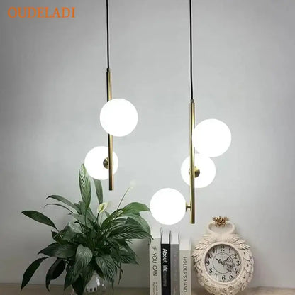 Modern brass and black glass ball pendant light dining room